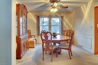 Formal Dining room with wainscot located right off