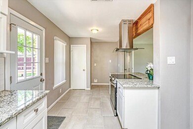 Kitchen featuring light tile patterned flooring, w
