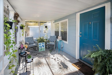 Wooden terrace featuring a sunroom