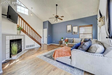 Enter into a living room with vaulted ceiling, eng