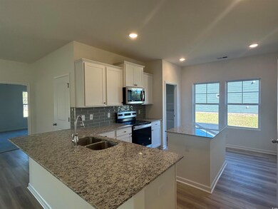 Kitchen with a wealth of natural light, stainless 
