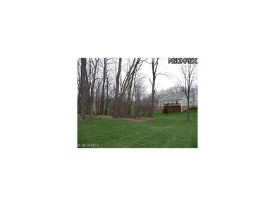 Spacious yard with treed area.