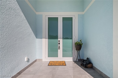 Entrance to property with french doors
