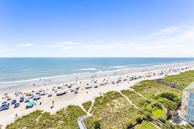 Bird's eye view featuring a water view and a beach