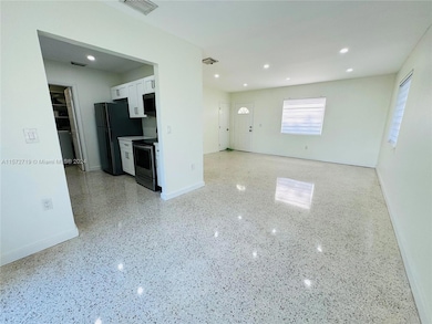 View from Back sliding door to Kitchen and Living /Dining Area