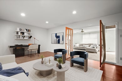 Living area featuring french doors, recessed ligh