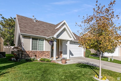 View of front of home with brick siding, concrete driveway, a shingled roof, and an attached garage