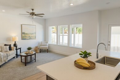 Living room featuring light wood finished floors, recessed lighting, and a ceiling fan