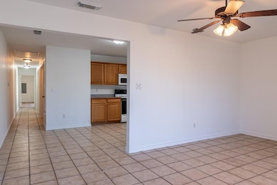 Kitchen featuring light tile patterned floors, whi