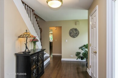 Light bright Foyer greets you with gleaming hardwo