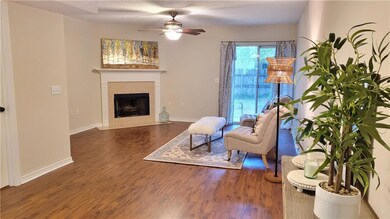 Wood burning fireplace and ceiling fan.