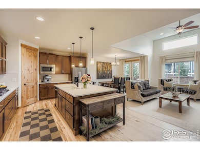 Tharp wood cabinetry meets modern touches in this spacious, entertainer-ready kitchen.