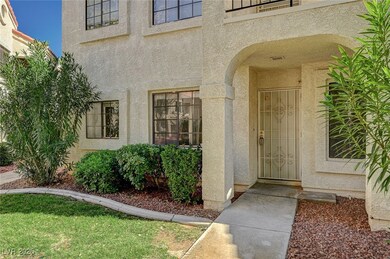 Entrance to property with stucco siding