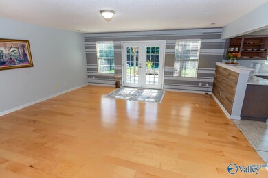 20'X19' GREAT ROOM OPEN TO KITCHEN.  HARDWOOD FLOORING AND UPDATED COLORS THROUGHOUT HOME.