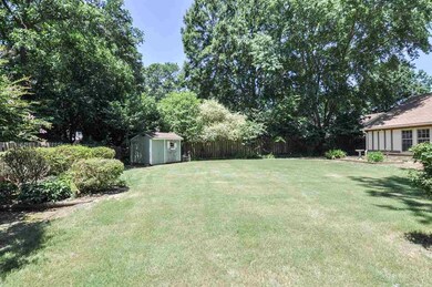 This spacious, fenced backyard has plenty of room 