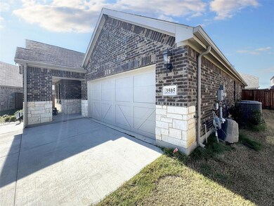 View of side of property featuring a garage and central air condition unit