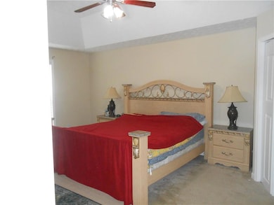 Bedroom with carpet and ceiling fan