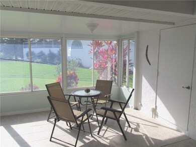L-Shaped Porch with Storage and Laundry Closets