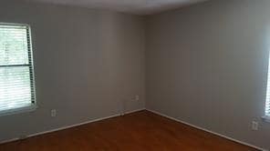 Spare room featuring healthy amount of natural light