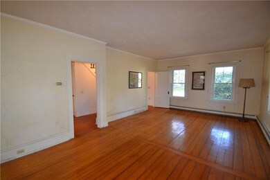 Double parlor with french doors opening to the fam