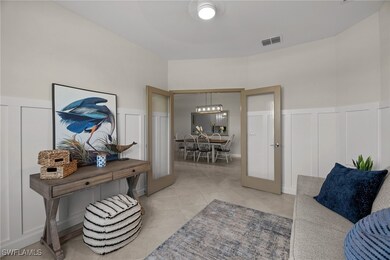 Living room featuring a decorative wall, a wainsco