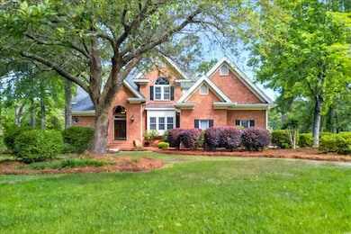 View of front of property with brick siding and a 
