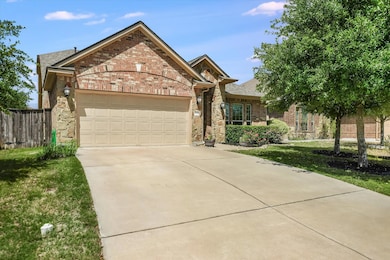 Ranch-style house with an attached garage, brick 