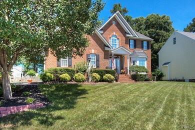 Wonderfully landscaped yard with landscape lightin