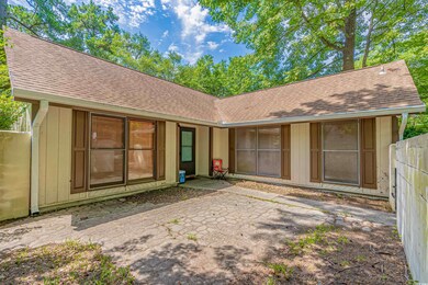Rear view of property featuring a patio