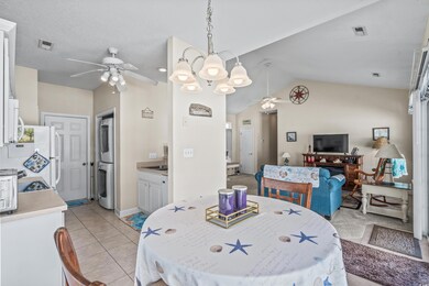 Dining room featuring vaulted ceiling, ceiling fan