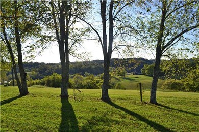 Sensational sunsets and sweeping countryside views can be seen for miles from atop one of the highest points in the area.  A long private drive leads to the home and 2 others that are located well off the road where they are out of view.