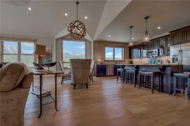 Solid hardwood flooring and windows abound to take