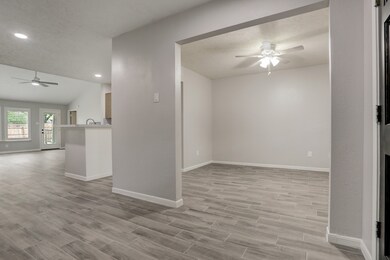 View of formal dining and living from entryway.