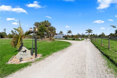 The road winds gently through the estate, lined by