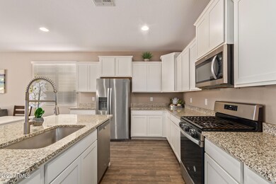 White Staggered Kitchen Cabinets