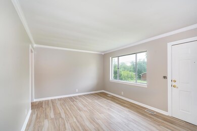 Large window in the Living Room gives the home a light and airy feel