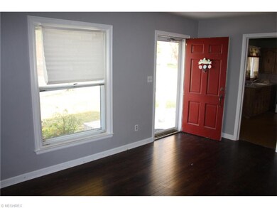 Living room.  Entry door leads to front porch.