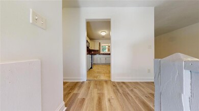 Corridor featuring light hardwood / wood-style flo