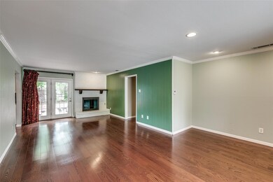 Unfurnished living room featuring ornamental moldi