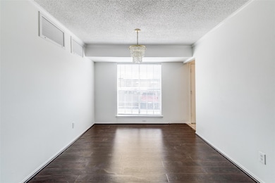 Dining room featuring a textured ceiling, visible 
