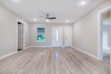 As you step inside, the living room welcomes you w