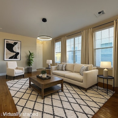 Living area featuring wood finished floors and baseboards