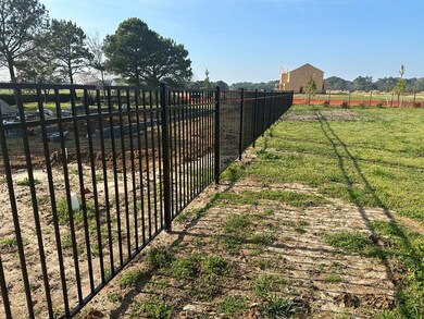 lot has aluminum fence around it