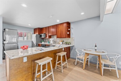 Kitchen has been opened up and an eating bar added