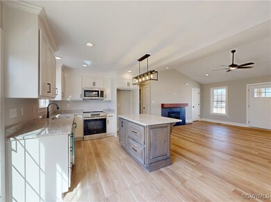 stainless steel appliances, lofted ceiling, white