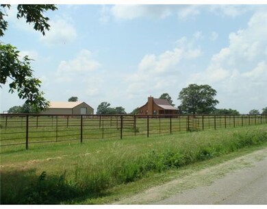 Exterior Front. RANCH HOUSE, 1600 SF Shop w/cement