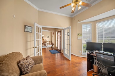 The details of the private study tucked behind double French doors, crown molding and a bay window allowing in tons of natural light!