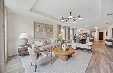 Expansive gathering room bathed in natural sunlight *Model representation

