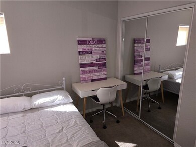 Bedroom featuring carpet floors and an office area