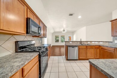 Nice size kitchen overlooks living area